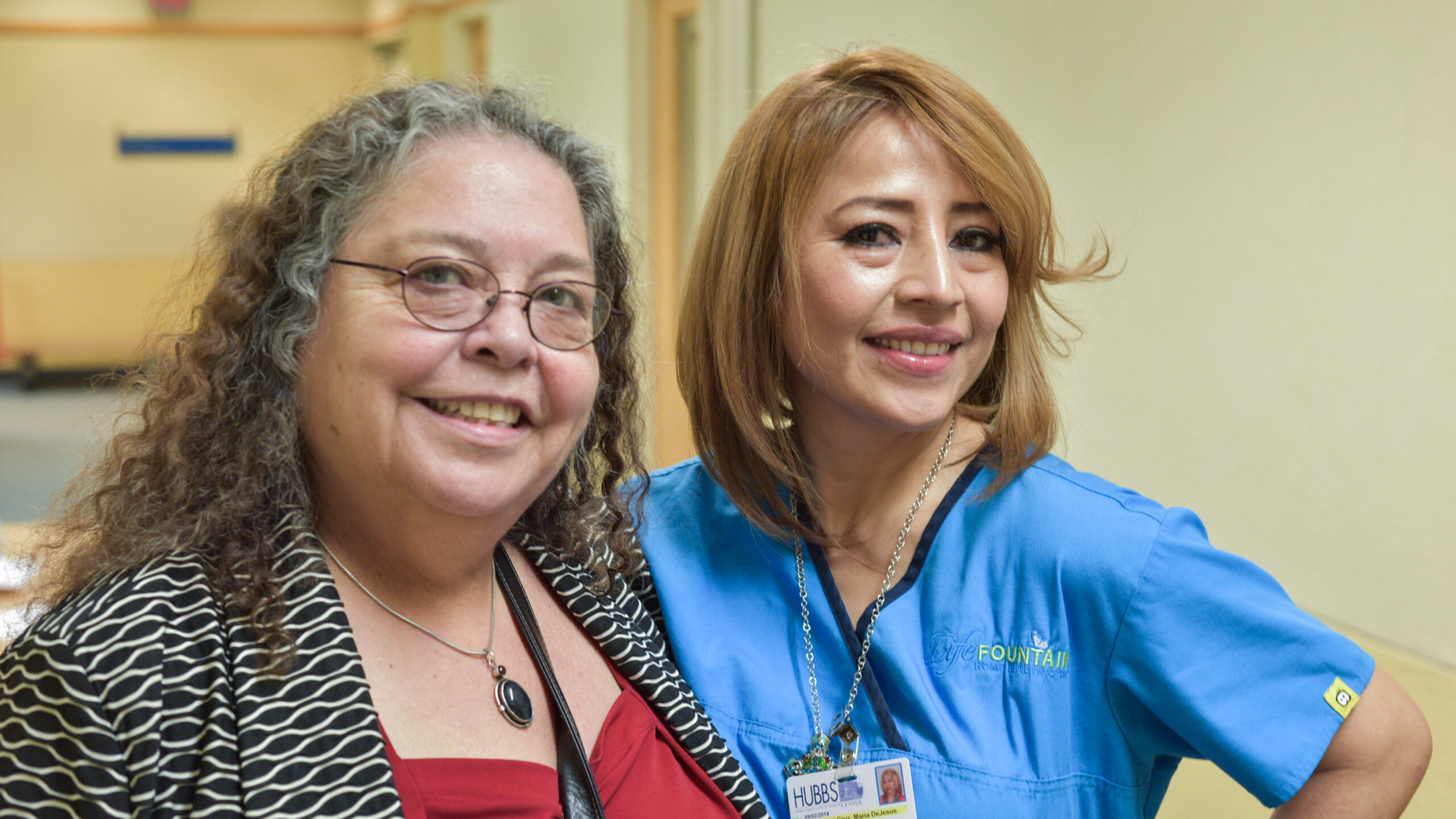Smiling woman with smiling healthcare worker