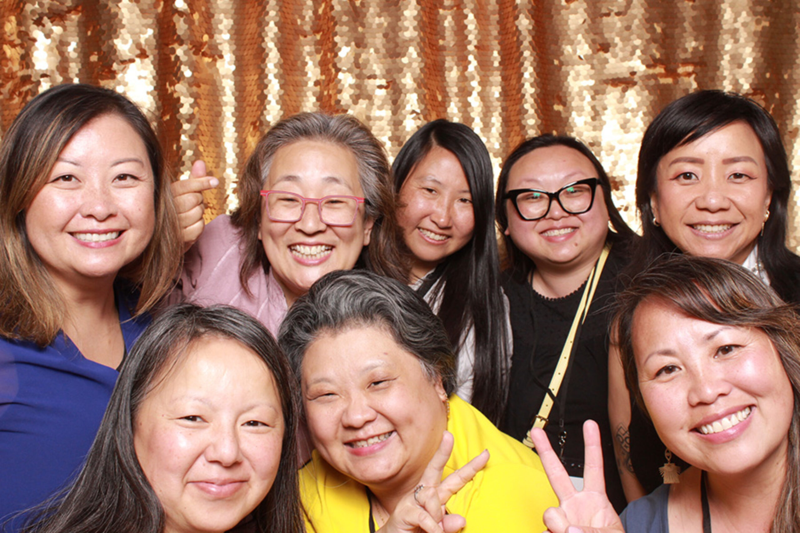 Group of people at 75th anniversary event photo booth